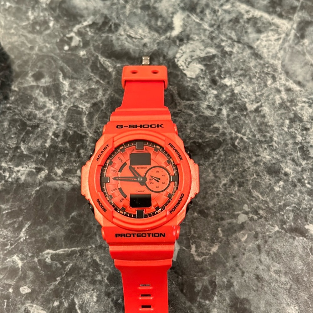 Men’s G-Shock watch like new burnt orange color round face